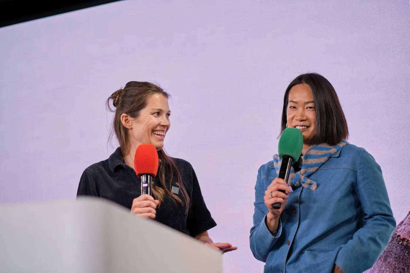Two speakers smiling as they share a talk at Female Founders Raise 2026